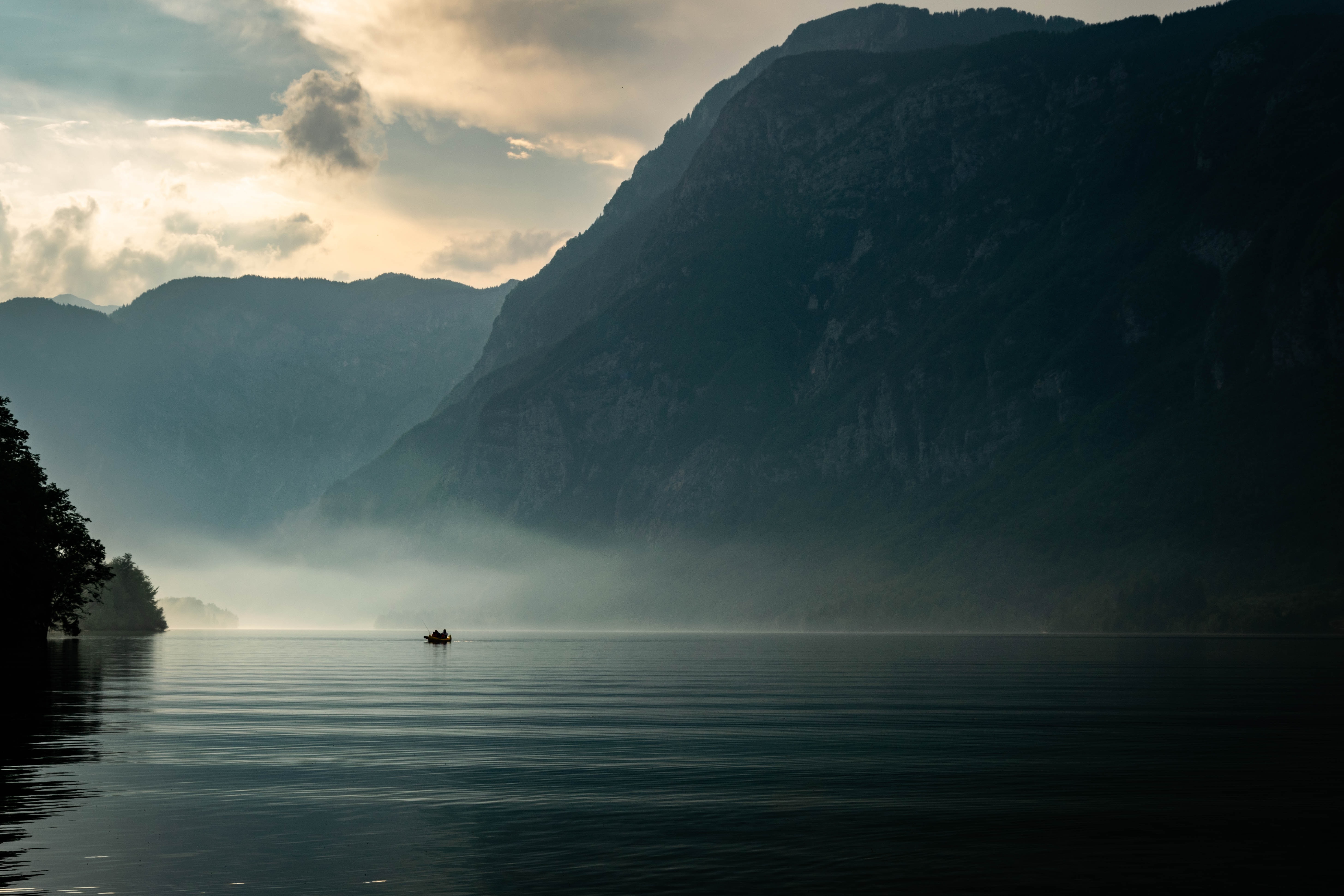 a boat on a misty lake